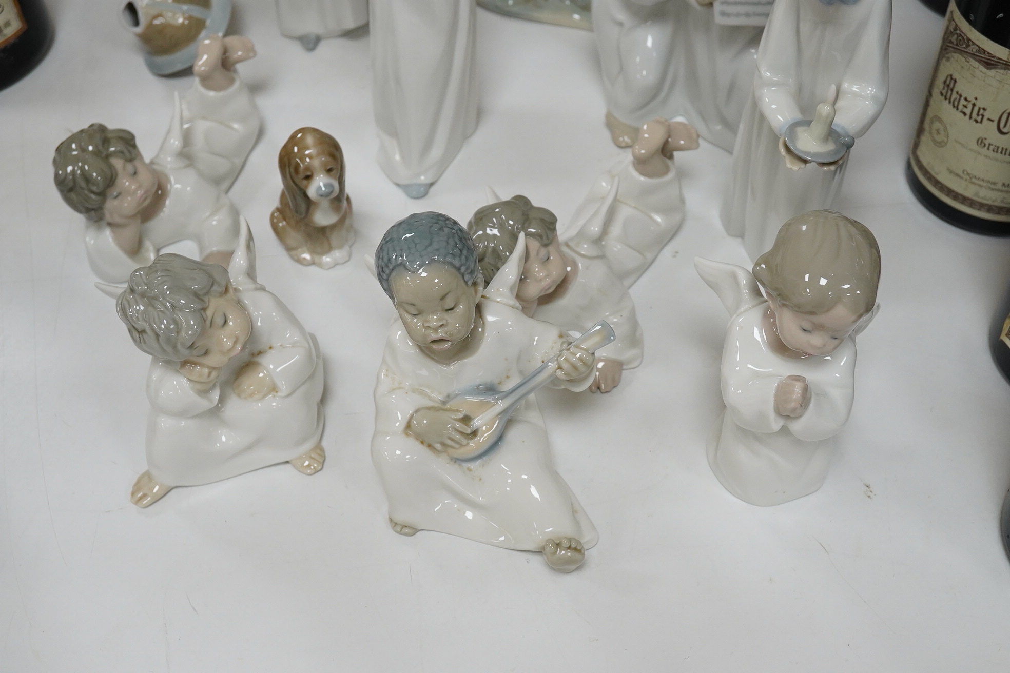 Fifteen Lladro figures or groups, 28cm high. Condition - one child group figure head broken.